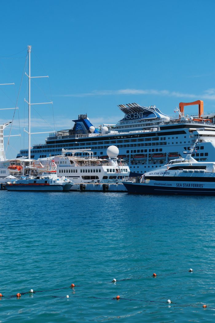 Vibrant cruise ships docked at a sunny port, ideal for travel and vacation themes.